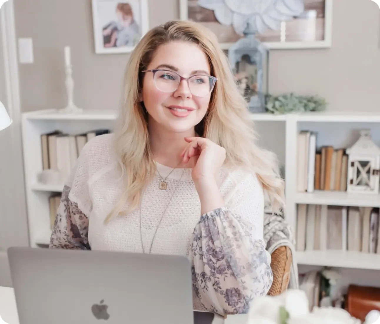 Woman sitting at desk smiling