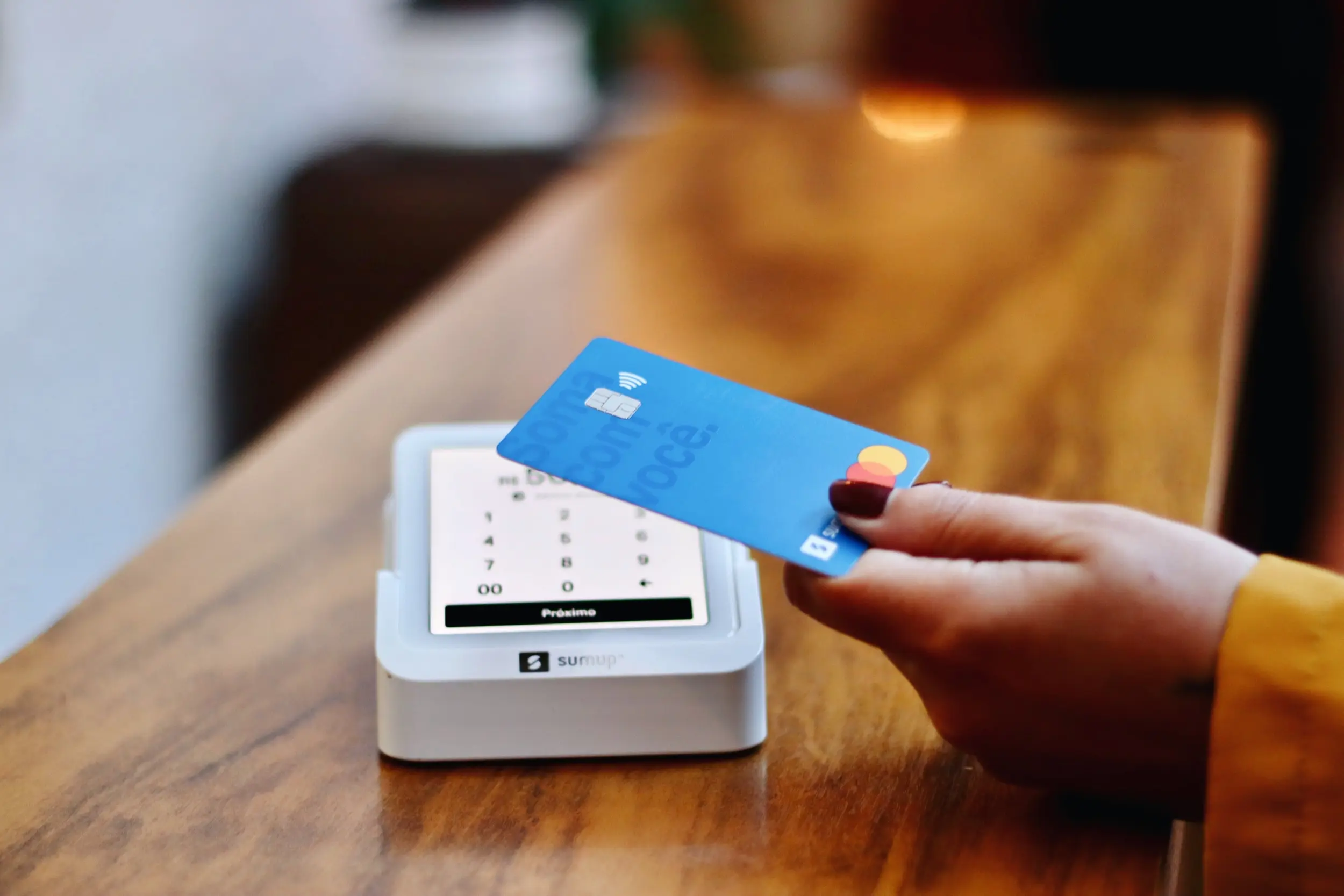 a credit card being used to pay at a terminal